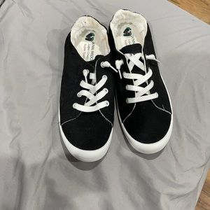 Black and white slip ons